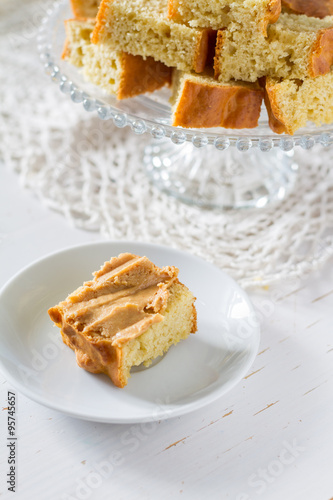 Corn bread cut in peaces on white wood background