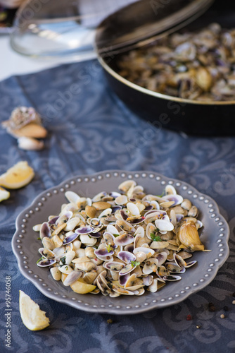 Stir fried clams with roasted paste,garlic, lemon, cilantro