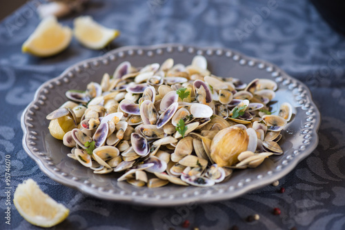 Stir fried clams with roasted paste,garlic, lemon, cilantro
