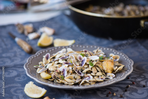 Stir fried clams with roasted paste,garlic, lemon, cilantro