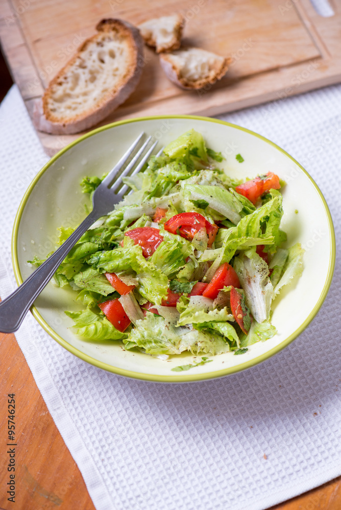 salad with lettuce leaves, cucumber and tomatoes salad with lettuce leaves, cucumber and tomatoes