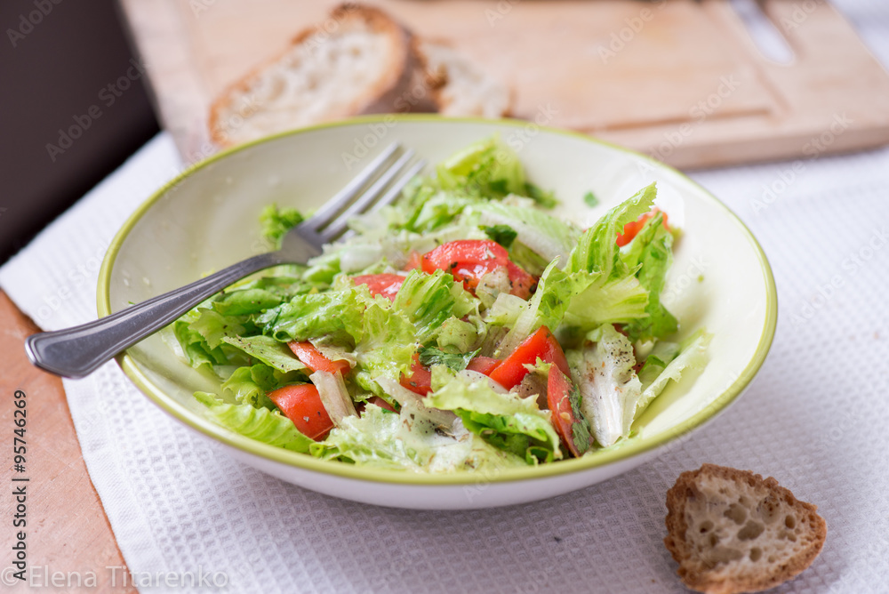 salad with lettuce leaves, cucumber and tomatoes salad with lettuce leaves, cucumber and tomatoes