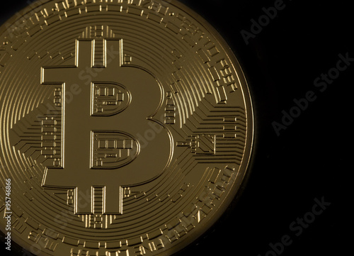 golden bitcoin in dark
