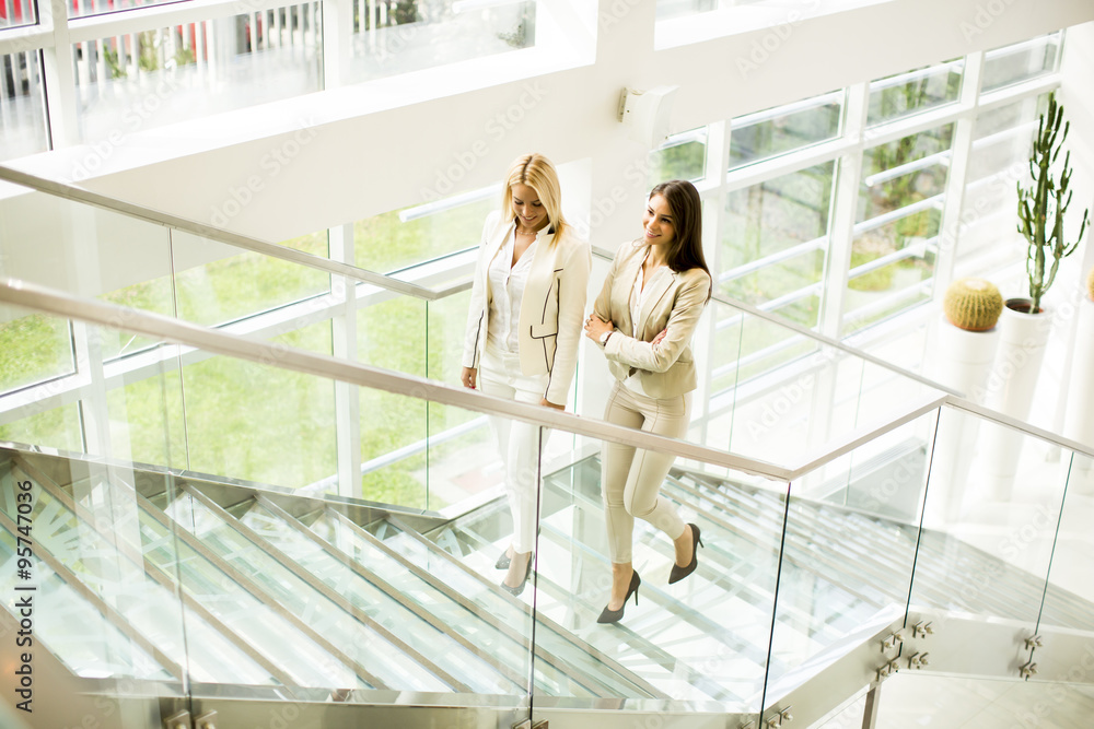 Young women walking in the office