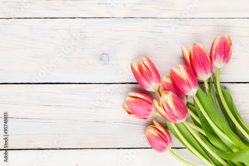 Fototapeta Naklejka Na Ścianę i Meble -  Colorful tulips on wooden table