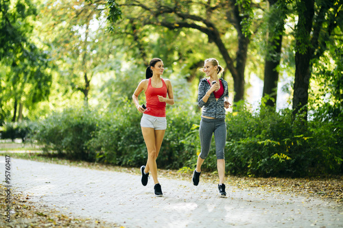 Athletic women jogging in nature