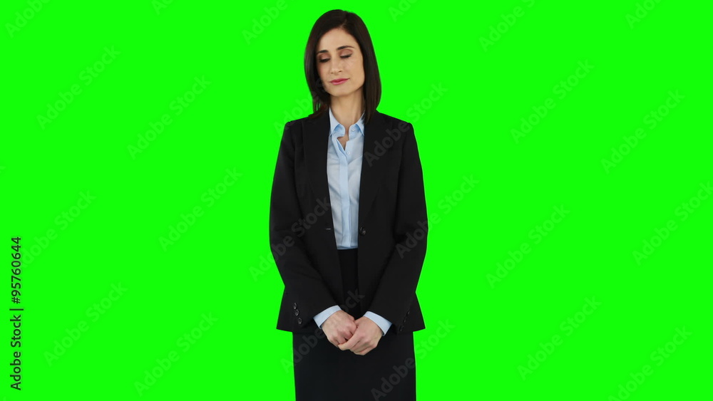 Smiling businesswoman pointing at screen Smiling businesswoman pointing at screen