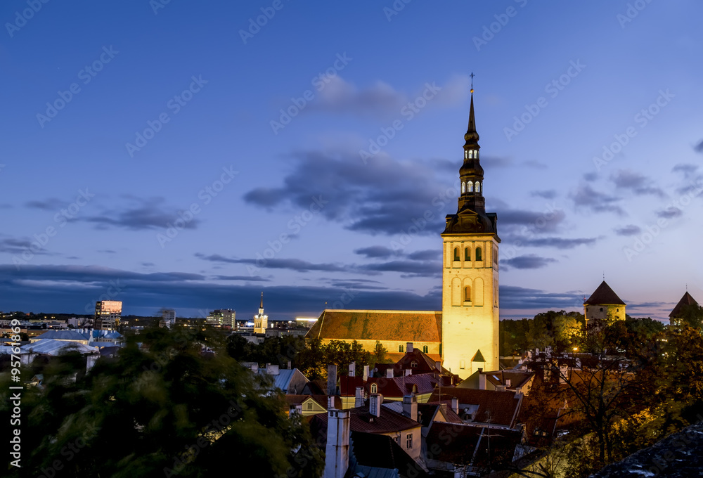 View of  St Nicholas Church  in old Tallinn at sunset . Estonia
