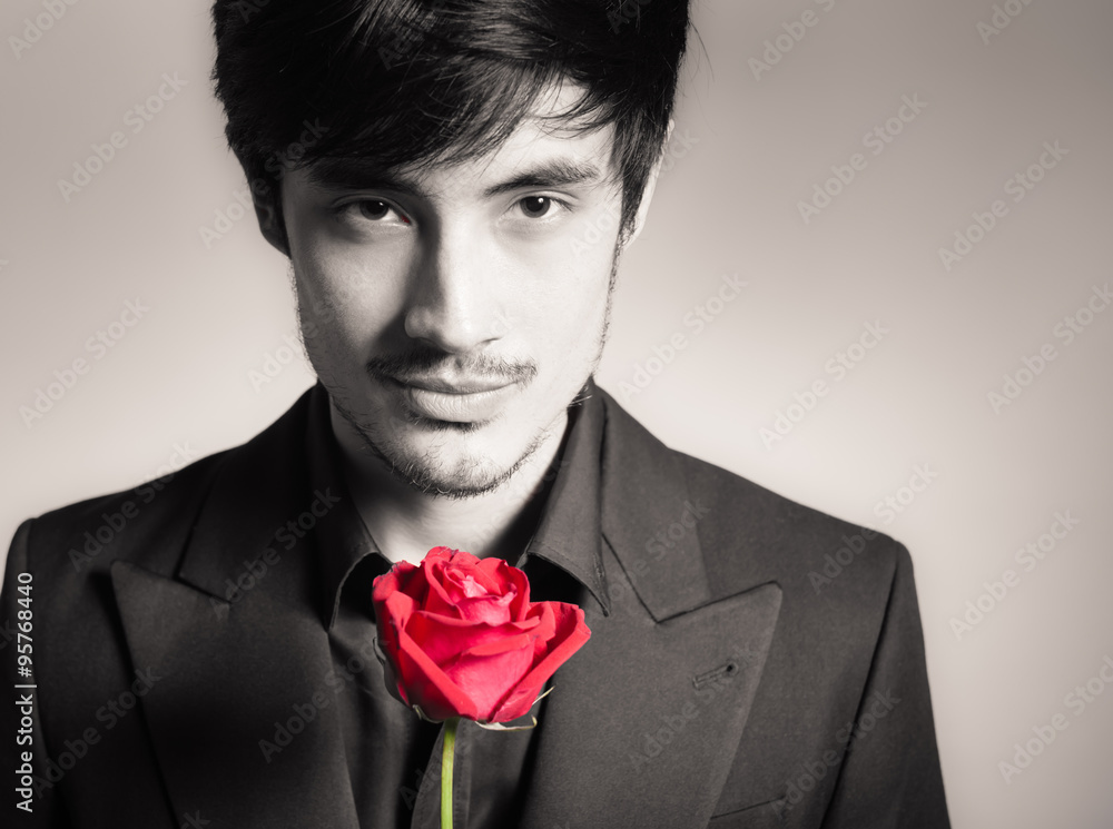 Handsome man with single rose

