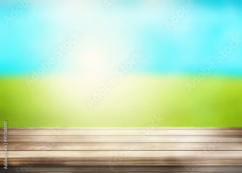 wood desk sunny outdoor gre...