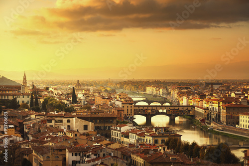 Fototapeta Naklejka Na Ścianę i Meble -  Florence or Firenze sunset Ponte Vecchio bridge panoramic view.T