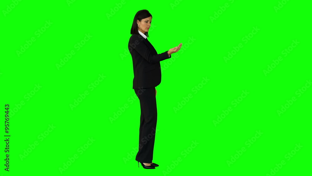 Businesswoman wearing something with her hands Businesswoman wearing something with her hands