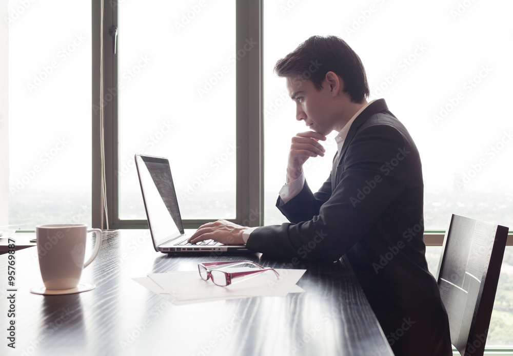 Businessman using computer in the office,
Businessman using computer in the office,