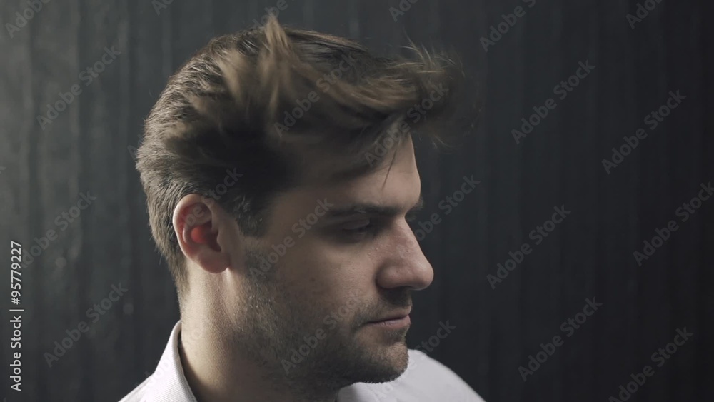 The man with flowing hair at the hairdresser salon in slow motion The man with flowing hair at the hairdresser salon in slow motion