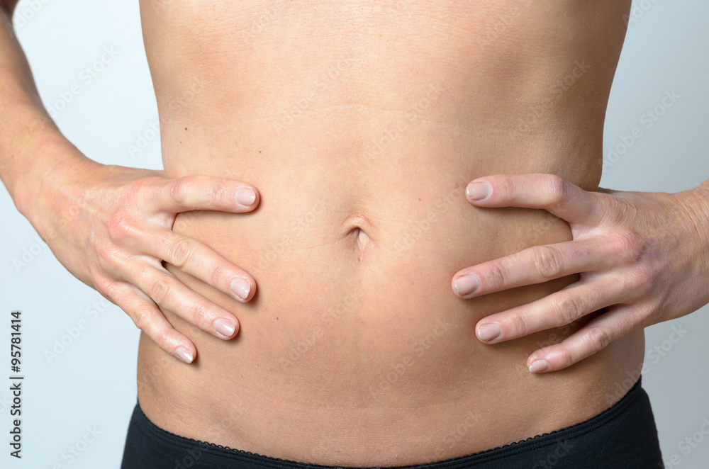 Flat Belly of a Bare middle-aged Slender Woman Flat Belly of a Bare middle-aged Slender Woman