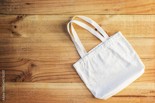 White cotton bag place on a wooden