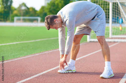 Shot of a runner preparing for his event