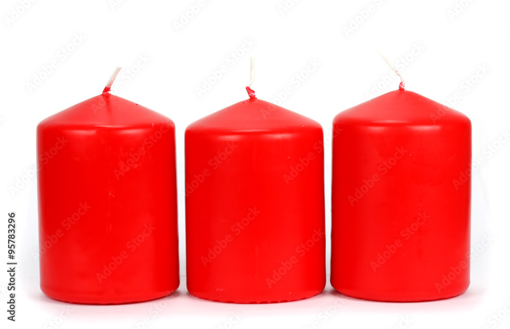 Three red candle wax on a white background Three red candle wax on a white background