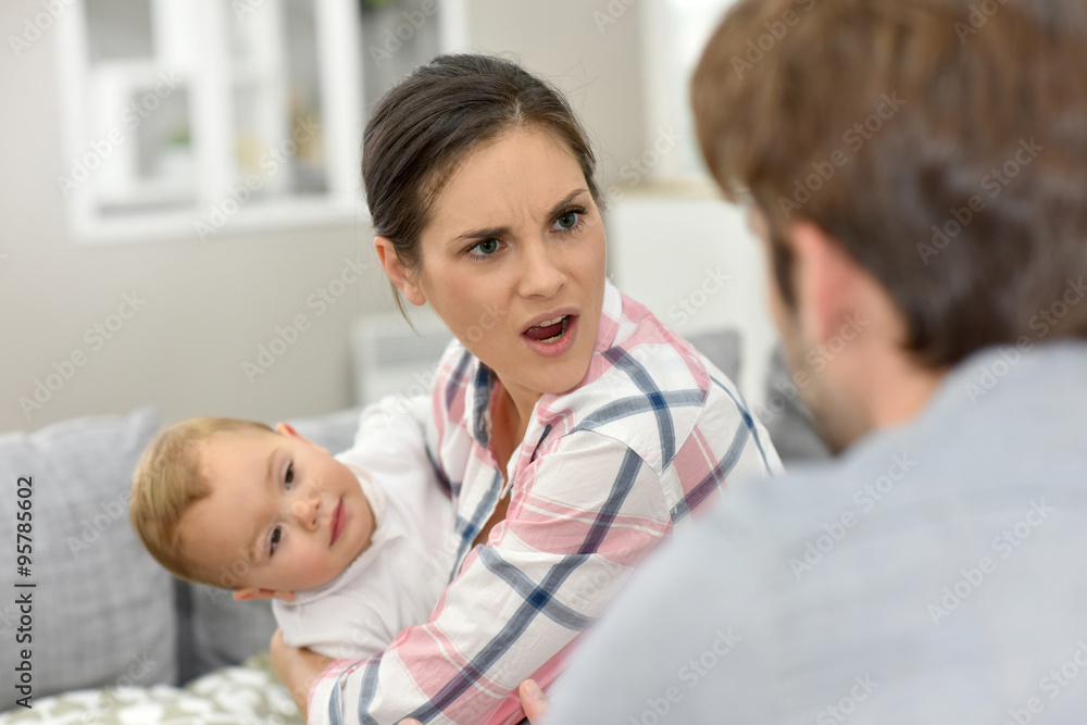 Man and woman arguing in front of baby Man and woman arguing in front of baby