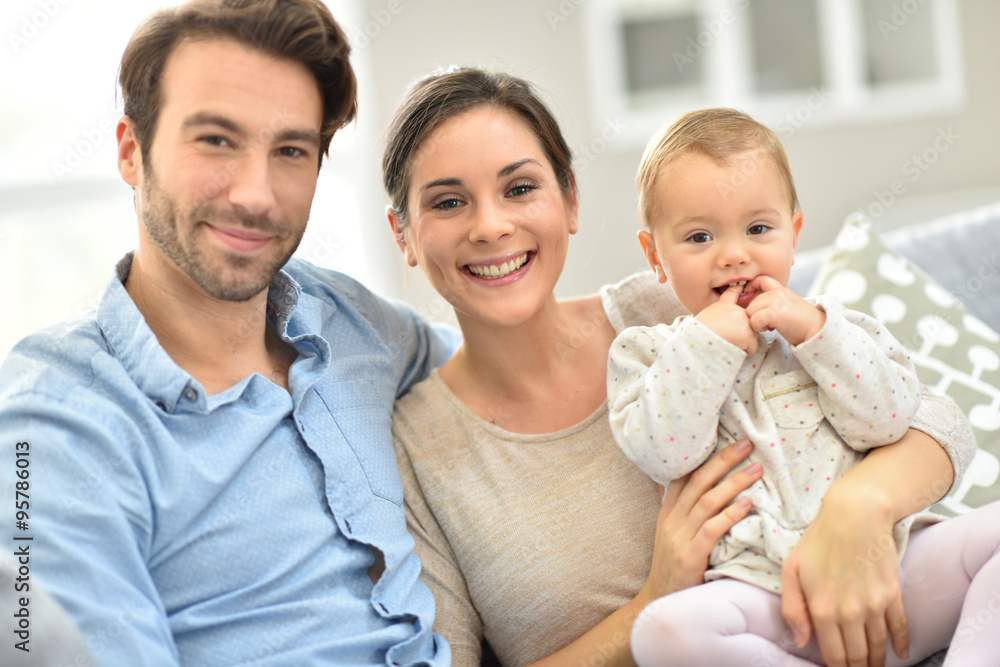 Portrait of happy young family of three Portrait of happy young family of three