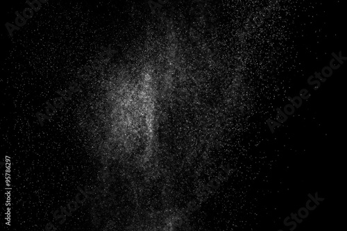 abstract splashes of water on a black background. splashes of milk. abstract spray of water. abstract rain. shower water drops. white dust explosion. abstract texture. abstract black background.