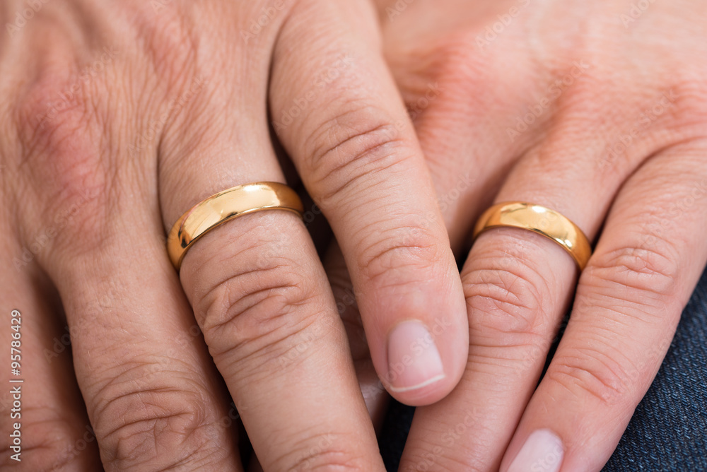 Close-up Of Hands With Rings