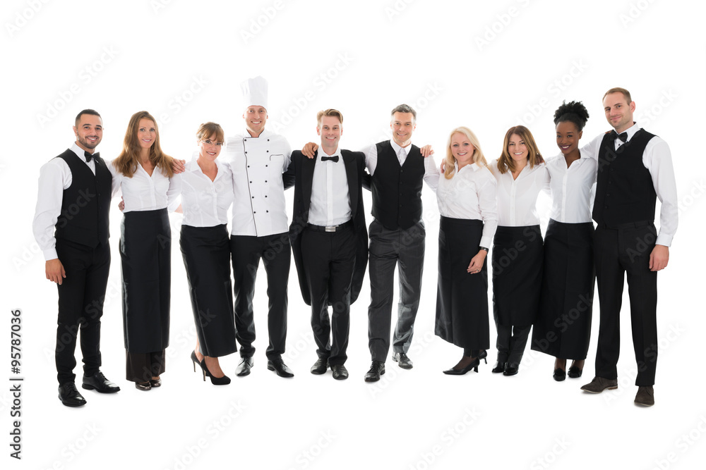 Confident Restaurant Staff Standing With Arms Around Confident Restaurant Staff Standing With Arms Around