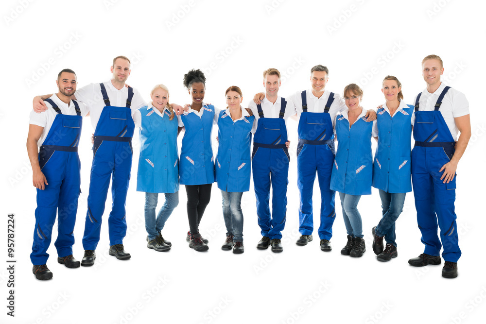 Obraz premium Confident Multiethnic Janitors Standing With Arms Around