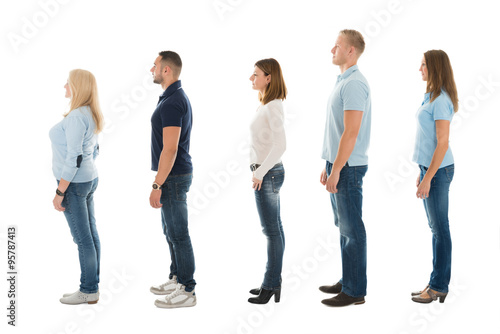 Side View Of People Standing In Queue