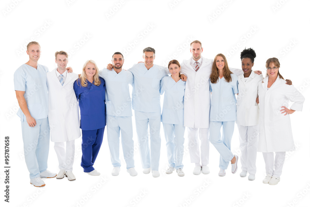 Confident Medical Team Standing With Arms Around Confident Medical Team Standing With Arms Around