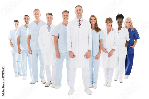Portrait Of Confident Doctor Standing With His Team
