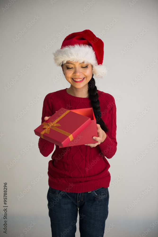 chinese girl opening christmas gift surprise look chinese girl opening christmas gift surprise look
