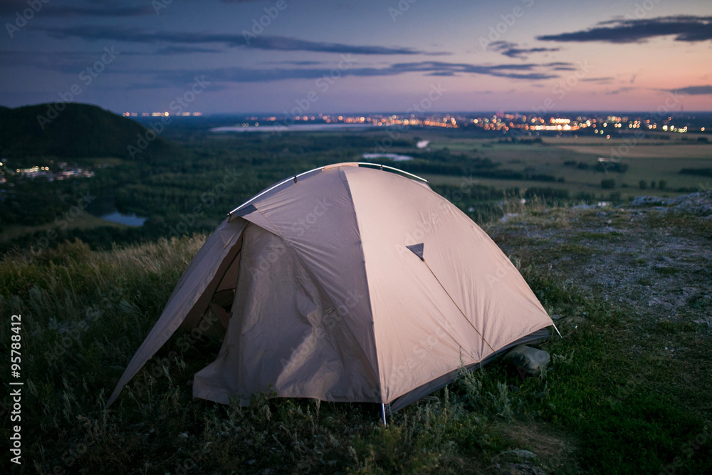 Tent and city lights