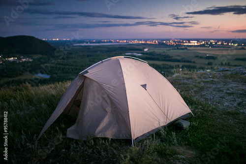 Tent and city lights