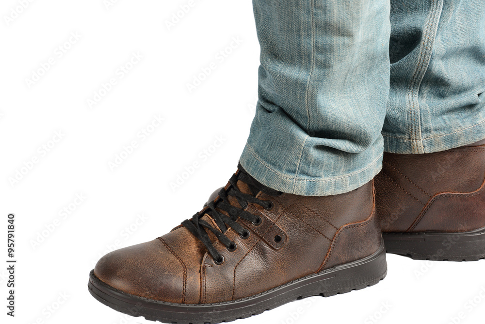 Man standing in jeans and boots