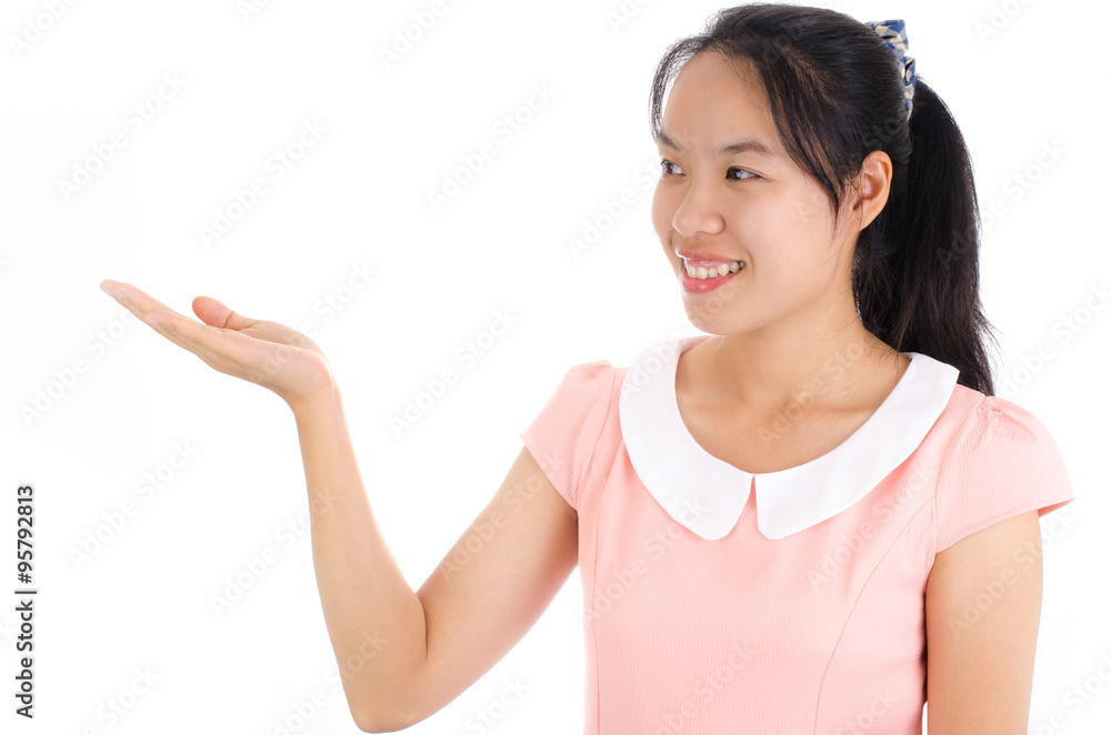 Portrait of young asian woman smile and show hand or presentation something on white background Portrait of young asian woman smile and show hand or presentation something on white background