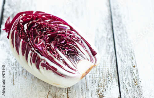Delicious red chicory salad on a wooden background