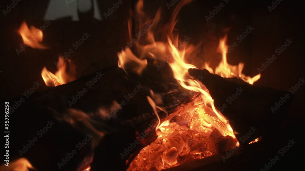 Hot fireplace full of wood and fire. Fire burning in slow motion. Hot fireplace full of wood and fire. Fire burning in slow motion.