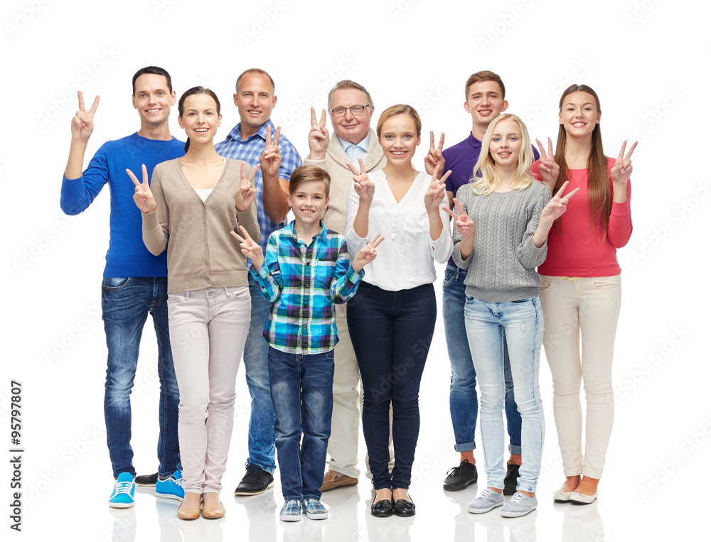 group of smiling people showing peace hand sign group of smiling people showing peace hand sign