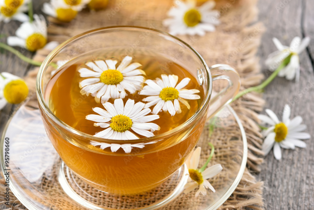 Chamomile tea in glass cup Chamomile tea in glass cup