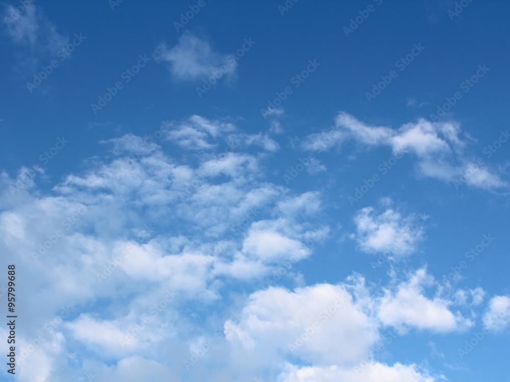 blue sky background with tiny clouds blue sky background with tiny clouds