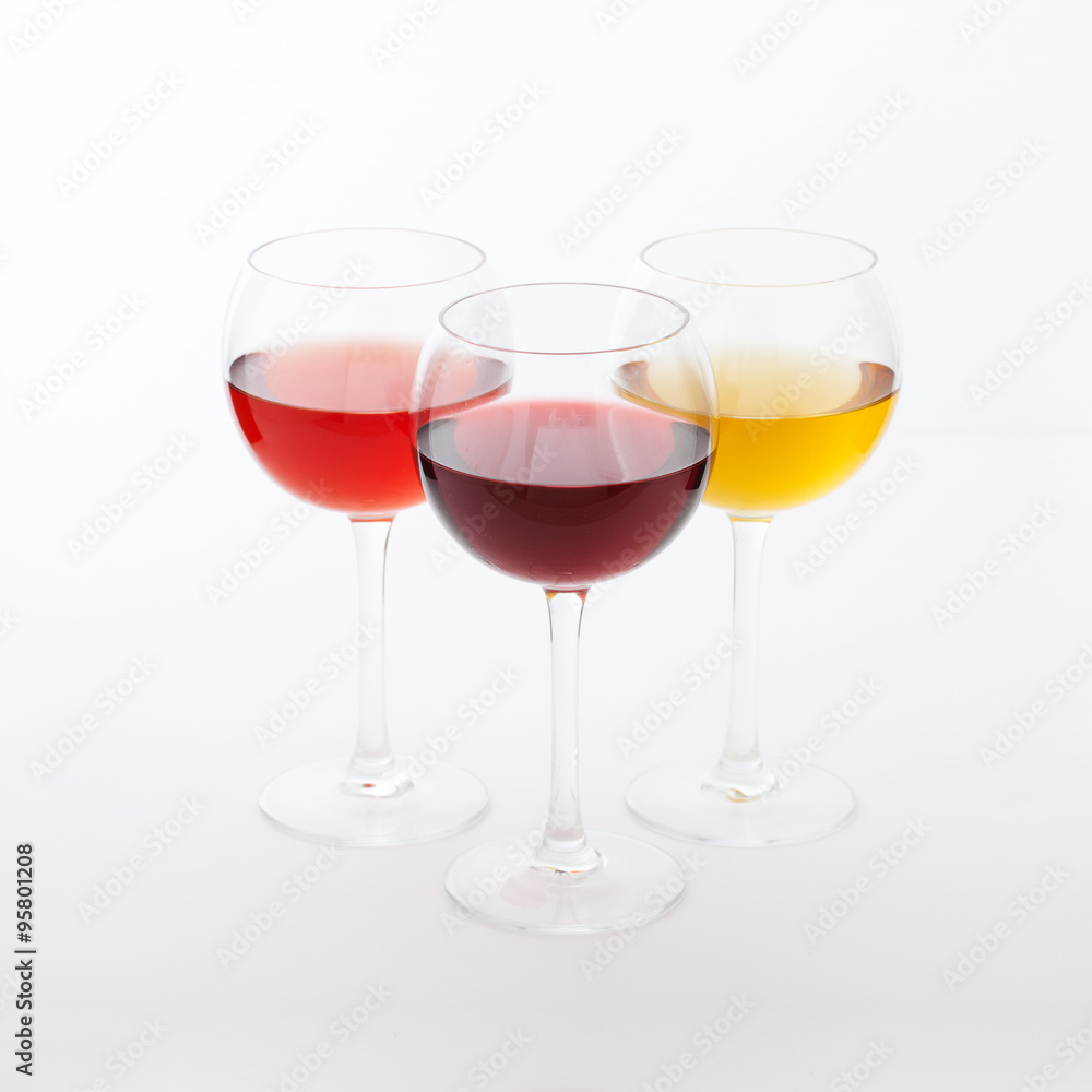 Wine bar, three glasses of wine unusual perspective on white background. Wine bar, three glasses of wine unusual perspective on white background.