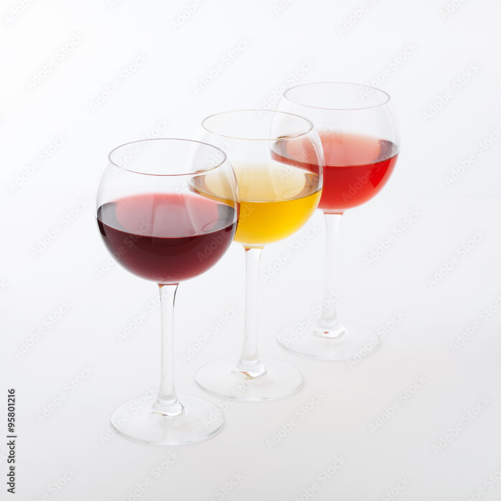 Wine bar, three glasses of wine unusual perspective on white background. Wine bar, three glasses of wine unusual perspective on white background.