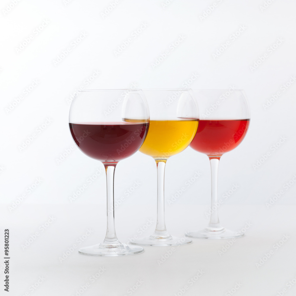Wine bar, three glasses of wine unusual perspective on white background. Wine bar, three glasses of wine unusual perspective on white background.