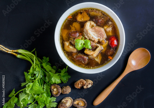 Top view, stew of pork and herbal soup, ba kut teh on black back photo