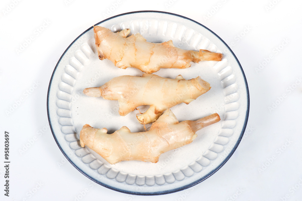 fresh ginger in white plate on white background fresh ginger in white plate on white background
