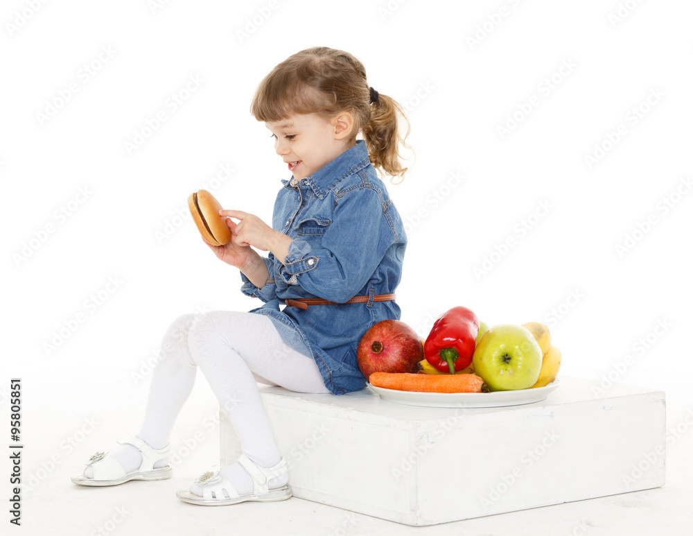 Child with hamburger and fruits. Child with hamburger and fruits.