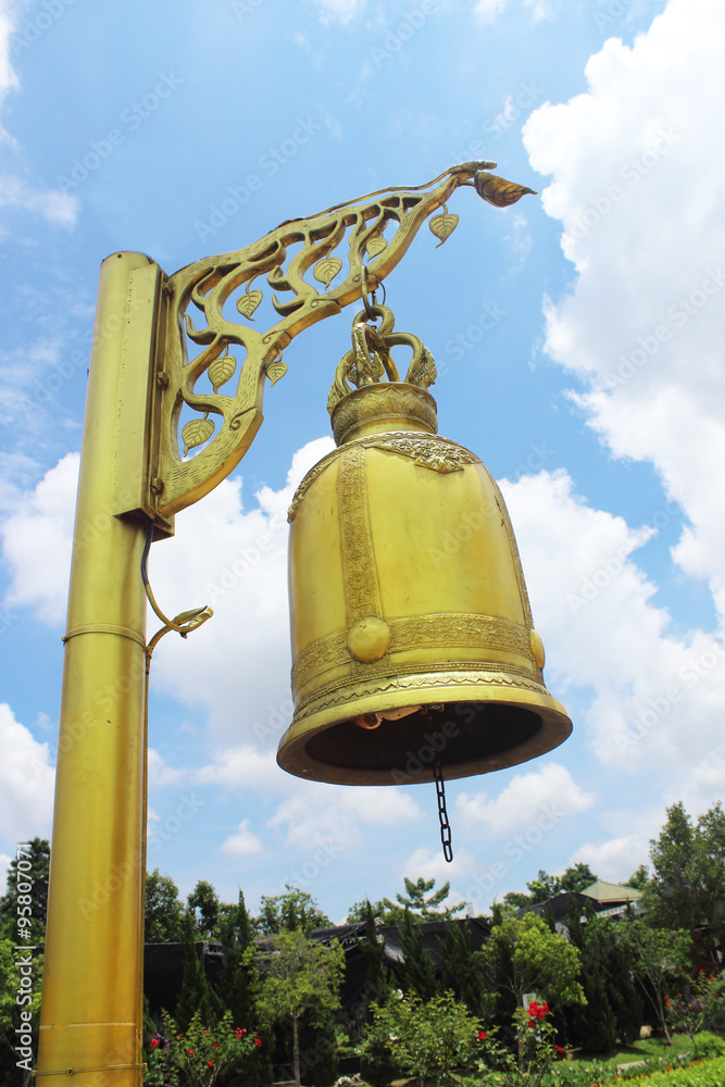 Fototapeta premium Golden bell isolated on blue sky