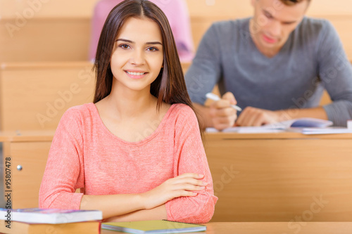 Student sitting at the desk.