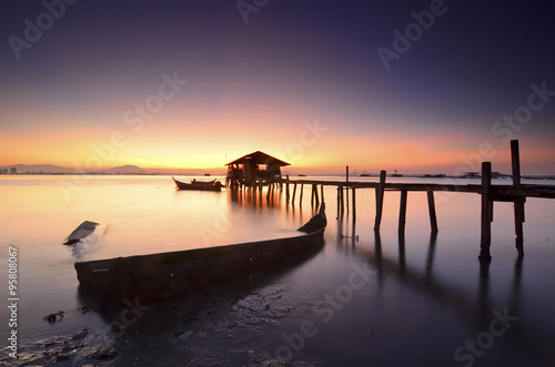 Silhouette of fisherman cottage during sunrise © nelzajamal